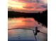 Beautiful sunset reflecting on the water, captured from a boat, highlighting the serene waterfront lifestyle at 48 Rosewood Ave, Ormond Beach, FL 32174