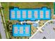 Aerial view of the community's pickleball complex with bright blue courts and meticulous landscaping at 540 Good Life Way, Daytona Beach, FL 32124