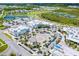 Aerial view of a shopping center with multiple retail stores, restaurants, and a central gathering square at 540 Good Life Way, Daytona Beach, FL 32124