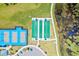 Overhead shot of well-maintained bocce ball and pickleball courts with lush green surroundings at 540 Good Life Way, Daytona Beach, FL 32124