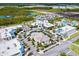 Aerial view of a vibrant community center with shops, restaurants, community square, and lush landscaping at 540 Good Life Way, Daytona Beach, FL 32124