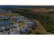 Elevated view of homes along a lake, highlighting community design and scenic surroundings at 540 Good Life Way, Daytona Beach, FL 32124