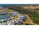 Shot of single-Gathering homes surrounding a small lake, complemented by a backdrop of lush greenery at 540 Good Life Way, Daytona Beach, FL 32124