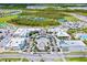 Overhead view of shopping center with retail stores, restaurants, parking, and landscaped common areas at 540 Good Life Way, Daytona Beach, FL 32124