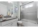 Bathroom featuring a glass shower, granite countertop, and ample lighting for a fresh, clean feel at 540 Good Life Way, Daytona Beach, FL 32124