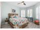 Charming bedroom with colorful accents, plantation shutters, and ample natural light for a vibrant atmosphere at 540 Good Life Way, Daytona Beach, FL 32124