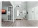 Inviting foyer with hardwood floors, high ceilings, coastal decor, and natural light streaming through the entrance at 540 Good Life Way, Daytona Beach, FL 32124