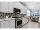 Bright kitchen featuring stainless steel appliances, stylish tile backsplash, and a dining nook at 540 Good Life Way, Daytona Beach, FL 32124