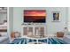 Living room featuring a cozy seating area, entertainment center, and stylish coastal decor at 540 Good Life Way, Daytona Beach, FL 32124