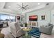Bright and airy living room with a coastal aesthetic, comfortable seating, and a flat-screen TV at 540 Good Life Way, Daytona Beach, FL 32124