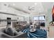 Bright and airy living room with a coastal aesthetic, comfortable seating, and seamless access to the outdoors at 540 Good Life Way, Daytona Beach, FL 32124