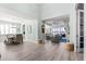 Open-concept living space with dining area, coastal decor, modern lighting, and abundant natural light at 540 Good Life Way, Daytona Beach, FL 32124