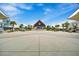 Town center with a gazebo-style stage, shops, restaurants, and lush landscaping at 540 Good Life Way, Daytona Beach, FL 32124