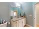 Updated bathroom with granite countertops, a vanity offering storage, and modern fixtures at 5431 Hutchinson St, Port Orange, FL 32128