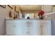 Bathroom featuring a double vanity with drawers, cabinets, granite countertop, and framed mirror at 5431 Hutchinson St, Port Orange, FL 32128