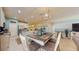 Spacious dining area adjacent to kitchen with stylish lighting and an open floor plan at 5431 Hutchinson St, Port Orange, FL 32128