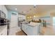 Modern kitchen featuring stainless steel appliances, island and convenient access to the dining area at 5431 Hutchinson St, Port Orange, FL 32128