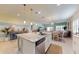 Open-concept kitchen with large island, stainless steel dishwasher, and adjacent living area for seamless entertaining at 5431 Hutchinson St, Port Orange, FL 32128