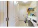Functional laundry room with a washer, dryer, and built-in shelving for storage and organization at 5431 Hutchinson St, Port Orange, FL 32128