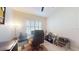 Bright office space featuring a modern desk, sleek furnishings, and shuttered windows for natural light at 5431 Hutchinson St, Port Orange, FL 32128