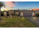 Charming single-story home featuring a well-maintained lawn and welcoming two-car garage at 6809 Plumpjack Ct, Port Orange, FL 32128