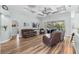Cozy living room featuring wood floors, recessed lighting, and a sliding glass door at 6809 Plumpjack Ct, Port Orange, FL 32128