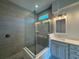 Modern bathroom with a frameless glass shower, stylish vanity, and sleek tile design at 1665 Lake Reserve Dr, Deland, FL 32724