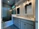 Elegant bathroom featuring double sinks, quartz countertops, and a large tiled shower at 1665 Lake Reserve Dr, Deland, FL 32724