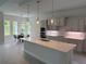 Modern kitchen with quartz countertops, stainless steel appliances, and stylish pendant lighting at 1665 Lake Reserve Dr, Deland, FL 32724