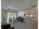 Open-concept living area featuring tile floors, modern furniture, and expansive backyard views at 1665 Lake Reserve Dr, Deland, FL 32724