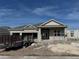 New construction home featuring stucco exterior, double-door entryway, and an attached two-car garage at 1720 Lake Reserve Dr, Deland, FL 32724
