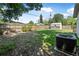 Spacious backyard featuring a lush lawn, mature trees, and a shed for extra storage at 1836 Biscayne Ave, South Daytona, FL 32119