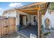 Enclosed carport with wood beam roof, providing covered parking and storage space at 1836 Biscayne Ave, South Daytona, FL 32119