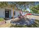 Charming home boasts a landscaped front yard with vibrant plants and an American flag at 1836 Biscayne Ave, South Daytona, FL 32119