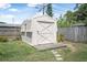 Durable backyard shed for storage, featuring a unique roof and wooden platform at 1836 Biscayne Ave, South Daytona, FL 32119