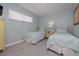 Light and bright bedroom featuring twin beds and neutral tones at 1155 Ocean Shore Blvd # 702, Ormond Beach, FL 32176