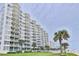 Multi-story condo building with wrap-around balconies, ocean views and lawn at 1155 Ocean Shore Blvd # 702, Ormond Beach, FL 32176