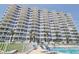 Beachfront condo with ocean views, balcony, pool and lounge chairs at 1155 Ocean Shore Blvd # 702, Ormond Beach, FL 32176