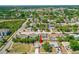 Aerial view of a community with houses, lush greenery, and well-maintained streets at 1197 Stillwood Ct, Port Orange, FL 32129