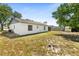 Side view of the home featuring the backyard, a storage shed, and partial fencing at 1197 Stillwood Ct, Port Orange, FL 32129