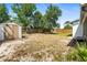 Spacious backyard with a storage shed and wood fence at 1197 Stillwood Ct, Port Orange, FL 32129