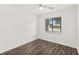 Bedroom featuring wood floors, a ceiling fan and a front yard view at 1197 Stillwood Ct, Port Orange, FL 32129