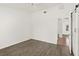 A clean bedroom with wood floor and a barn door leading to the bathroom at 1197 Stillwood Ct, Port Orange, FL 32129