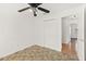 Bedroom features neutral walls, ceiling fan, and closet at 1197 Stillwood Ct, Port Orange, FL 32129