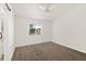 Bedroom featuring wood floors, a ceiling fan, and a front yard view at 1197 Stillwood Ct, Port Orange, FL 32129