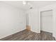 Bedroom with wood floors, closet, and door leading to hallway at 1197 Stillwood Ct, Port Orange, FL 32129
