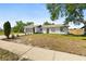 Charming single-story home with a well-maintained lawn, complemented by mature landscaping and a paved driveway at 1197 Stillwood Ct, Port Orange, FL 32129