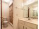 Bathroom featuring a single vanity, shower, toilet, and mirror at 140 Limewood Pl # 2, Ormond Beach, FL 32174