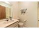 Neutral bathroom with a single sink vanity, toilet, and towel rack at 140 Limewood Pl # 2, Ormond Beach, FL 32174