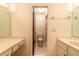 Bathroom featuring a double vanity, toilet, and mirrors at 140 Limewood Pl # 2, Ormond Beach, FL 32174